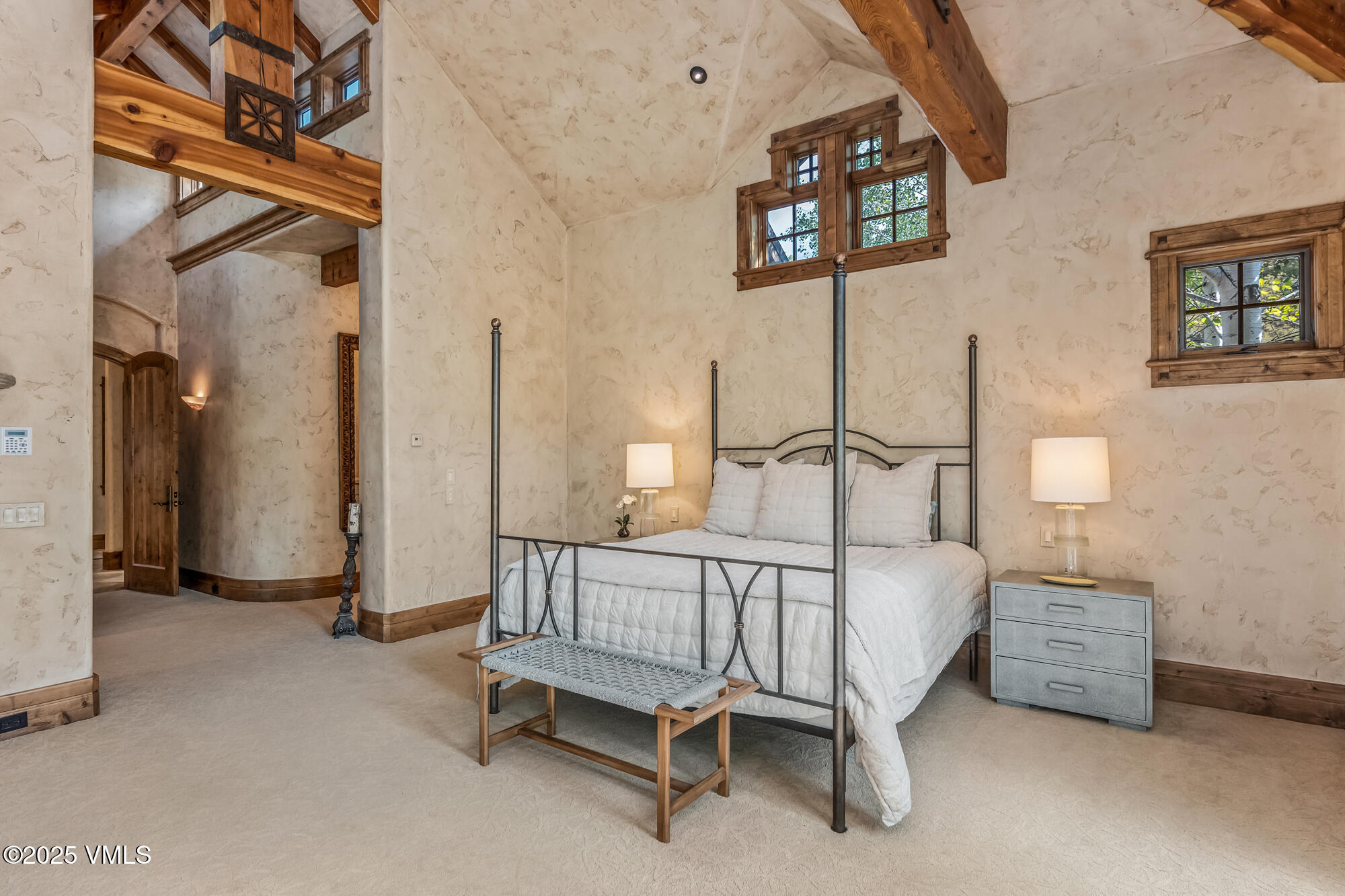 135 Andorra Road Edwards, CO 81632 - Photo 27 of 82 a white bed sitting in a room next to a lamp