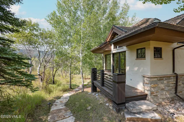 a bedroom with two beds and a large window