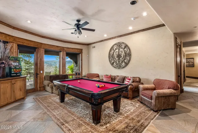 a view of a house with yard and sitting area