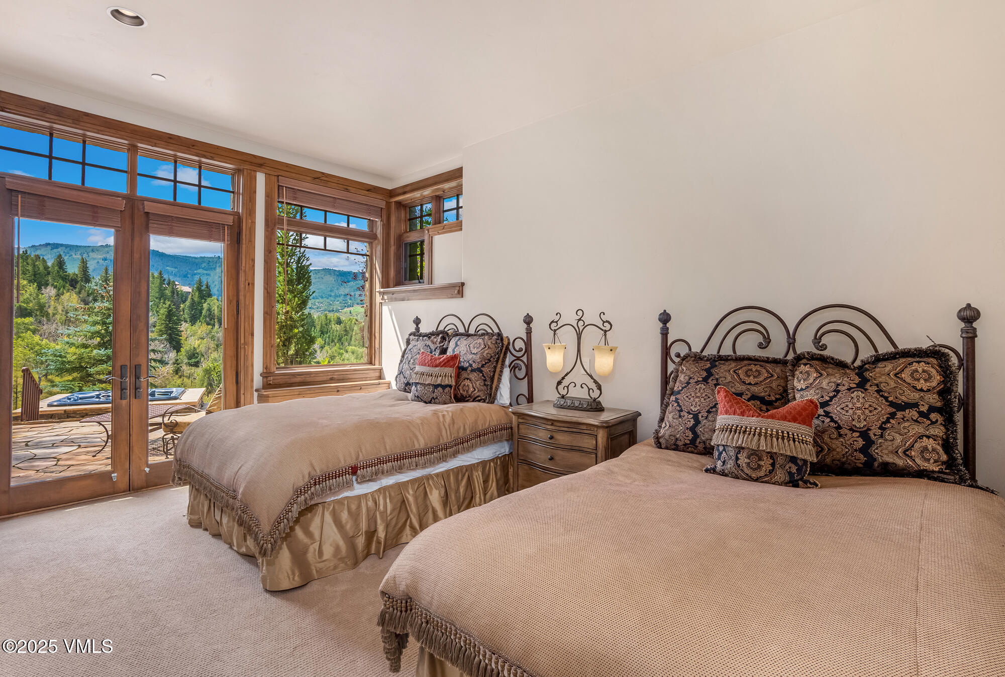 135 Andorra Road Edwards, CO 81632 - Photo 43 of 82 a bedroom with two beds and a large window