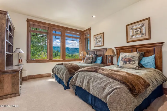 a view of house with yard and sitting area