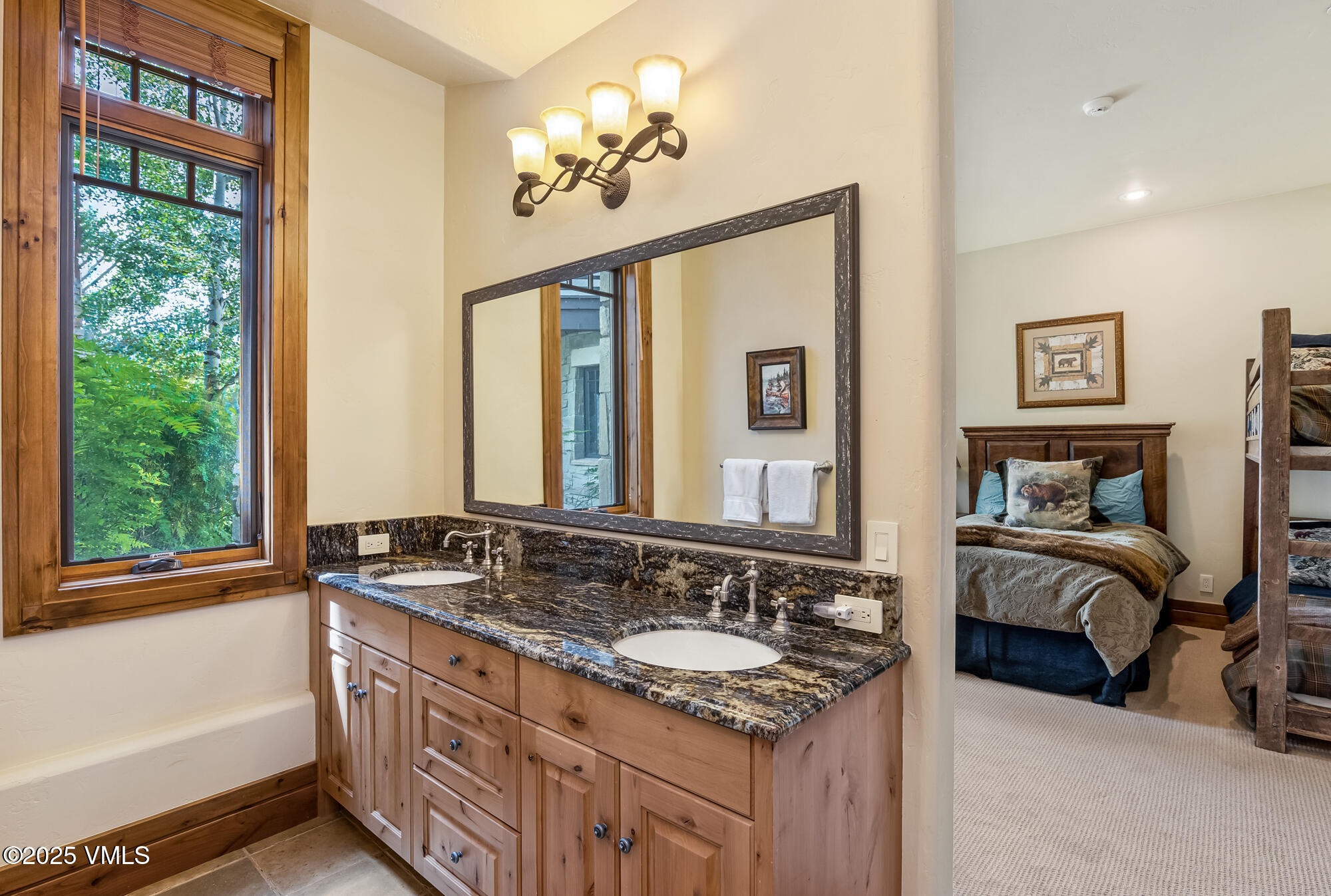 135 Andorra Road Edwards, CO 81632 - Photo 46 of 82 a bathroom with a granite countertop sink and a mirror