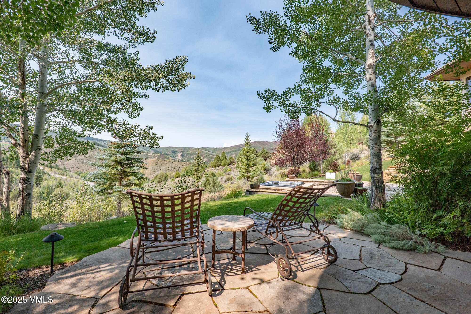 135 Andorra Road Edwards, CO 81632 - Photo 49 of 82 a view of a patio with table and chairs potted plants and large tree
