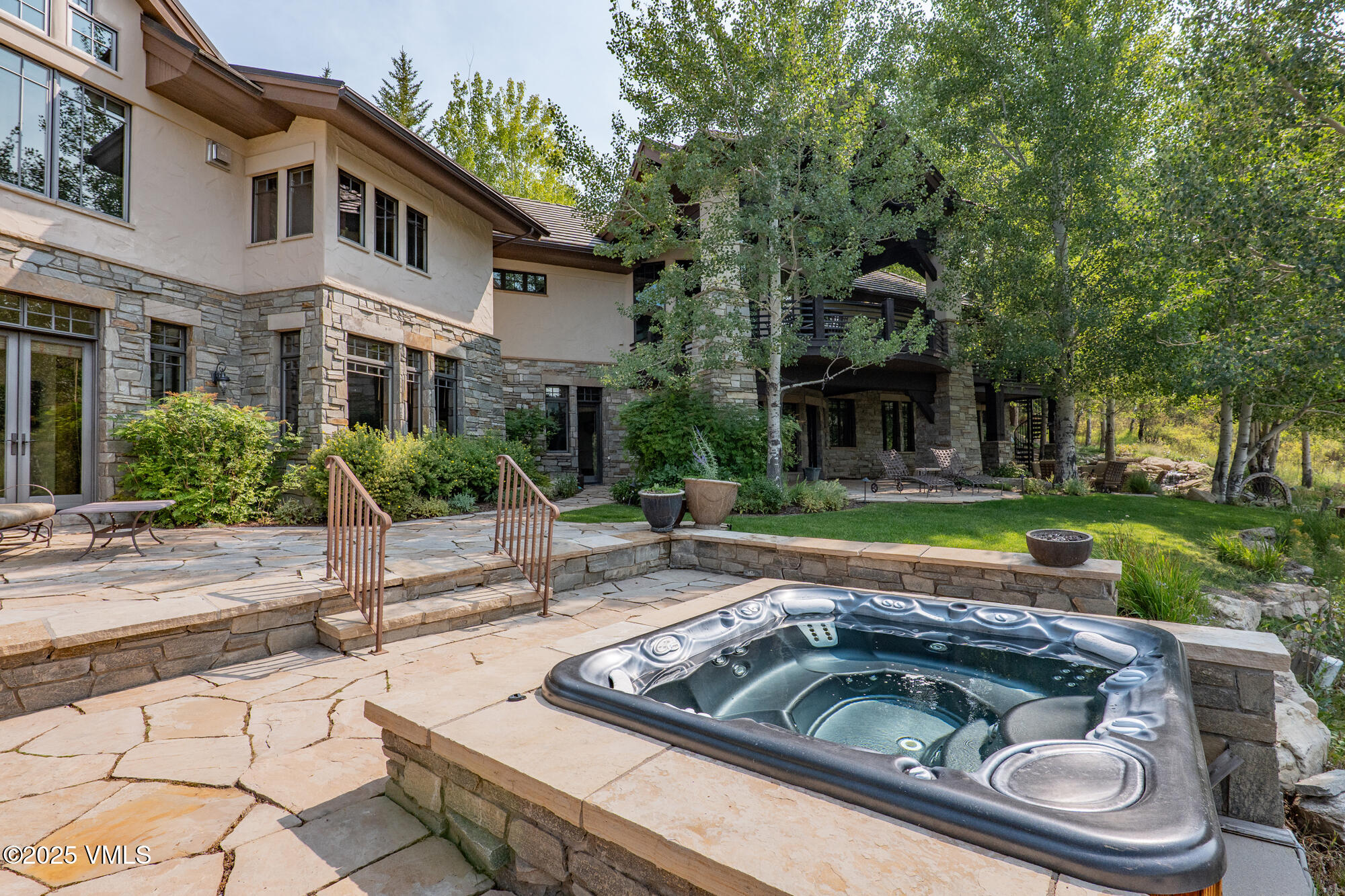 135 Andorra Road Edwards, CO 81632 - Photo 53 of 82 a view of a white house with a swimming pool and garden