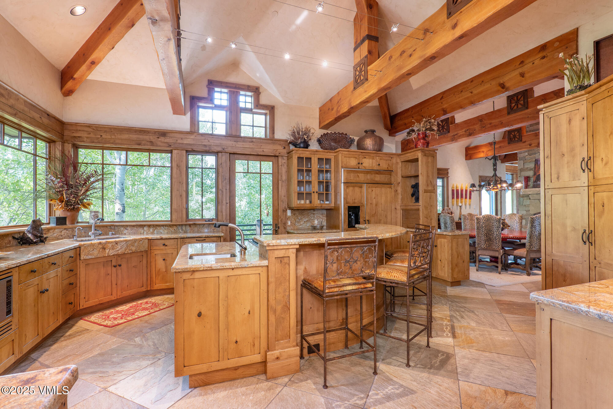 135 Andorra Road Edwards, CO 81632 - Photo 7 of 82 a dining hall with stainless steel appliances granite countertop a sink and cabinets