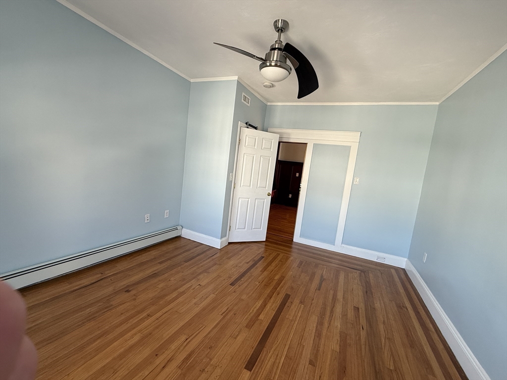 55 Lithgow Street, Unit 3 Boston, MA 02124 - Photo 13 of 16 a view of a hallway with wooden floor