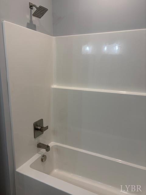 5461 Bear Creek Road Rustburg, VA 24588 - Photo 27 of 27 a bathroom with a white bath tub and a sink