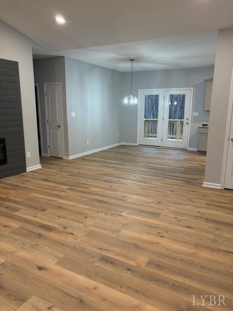 5461 Bear Creek Road Rustburg, VA 24588 - Photo 5 of 27 a view of an empty room with wooden floor and a window