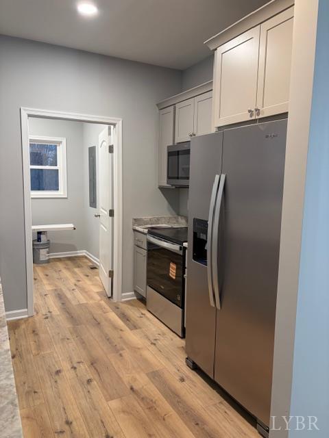 5461 Bear Creek Road Rustburg, VA 24588 - Photo 9 of 27 a kitchen with granite countertop a refrigerator and a sink