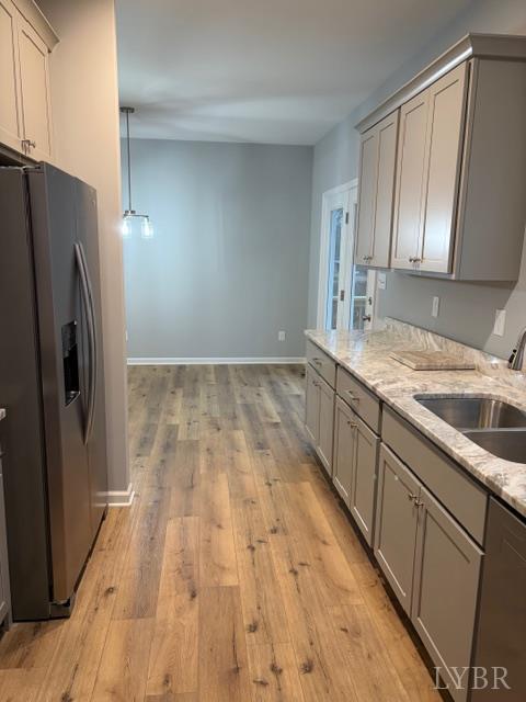 5461 Bear Creek Road Rustburg, VA 24588 - Photo 10 of 27 a view of a kitchen with a sink and refrigerator