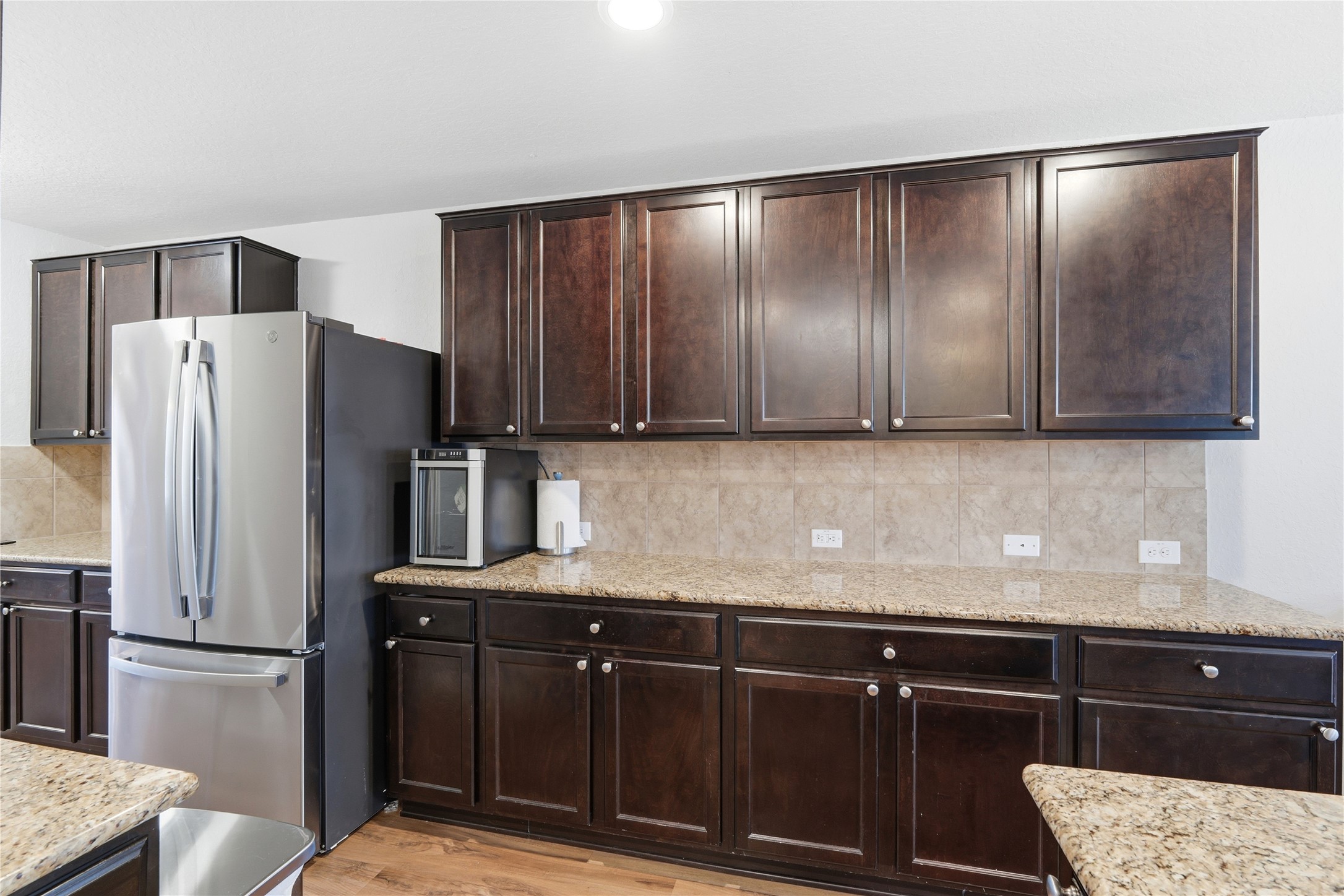 2811 Davis Trace San Antonio, TX 78245 - Photo 11 of 31 a kitchen with a refrigerator and cabinets