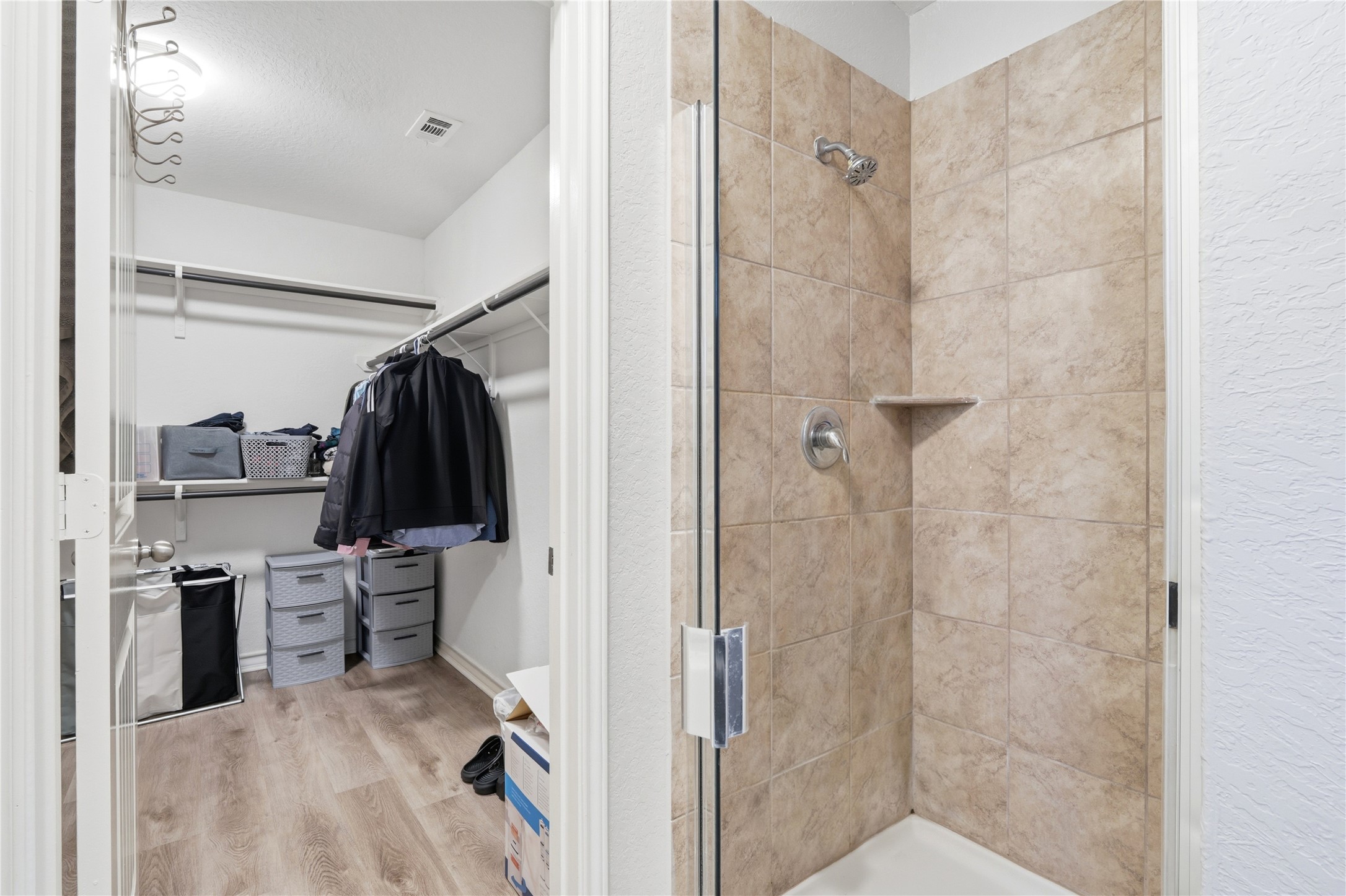 2811 Davis Trace San Antonio, TX 78245 - Photo 18 of 31 a view of walk in closet with clothes and shoes