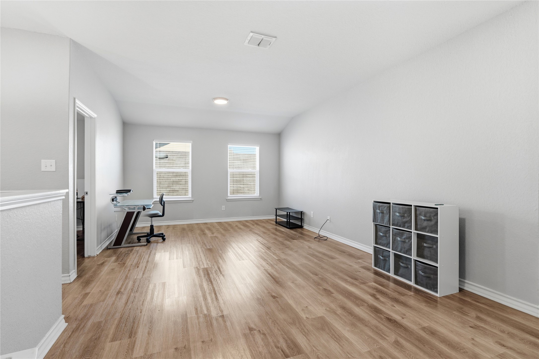 2811 Davis Trace San Antonio, TX 78245 - Photo 21 of 31 wooden floor in an empty room with a window