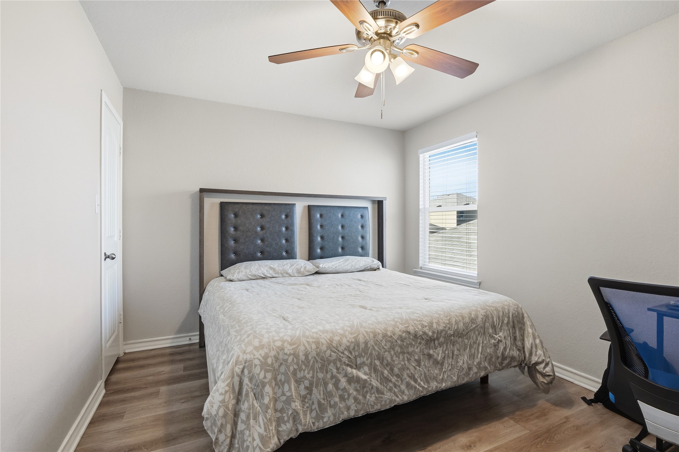 2811 Davis Trace San Antonio, TX 78245 - Photo 23 of 31 a bedroom with a bed and a chandelier