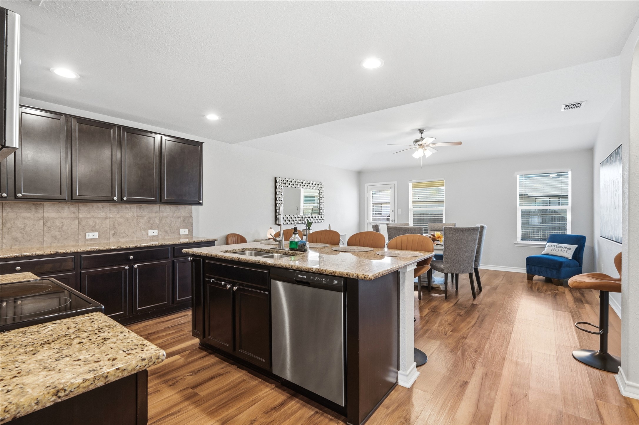 2811 Davis Trace San Antonio, TX 78245 - Photo 7 of 31 a kitchen with granite countertop a sink counter top space and stainless steel appliances