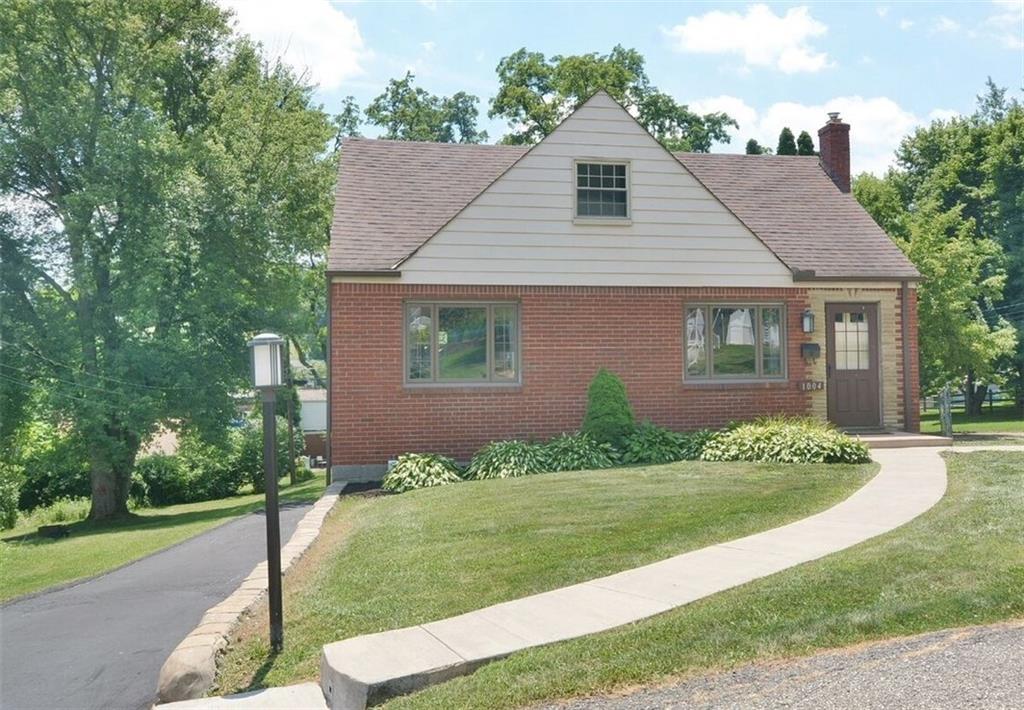 1004 Hastie Road Pittsburgh, PA 15234 - Photo 2 of 25 Large front yard. Long driveway runs along side of house and leads to an integral garage.