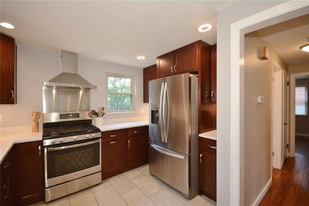 1004 Hastie Road Pittsburgh, PA 15234 - Photo 8 of 25 Completely remodeled kitchen 2017. Brand name Stainless Steel appliances. Cherry cabinetry and Quartz counter tops.