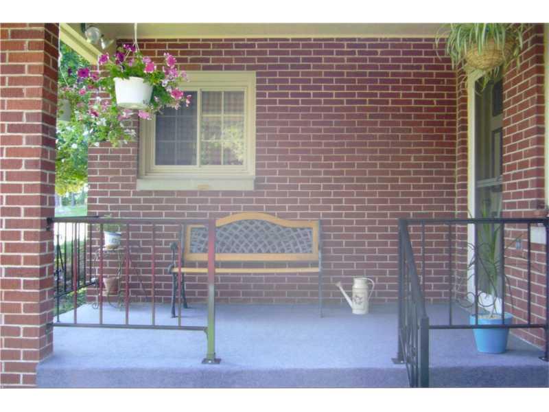 1057 Mercer Road Beaver Falls, PA 15010 - Photo 2 of 20 Exterior Front. This a springtime photo of the front porch- just Imagine the Possibilities!