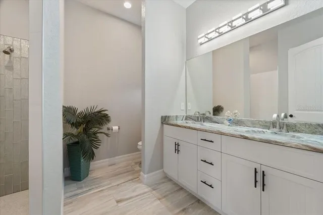 a bedroom with bed and a window