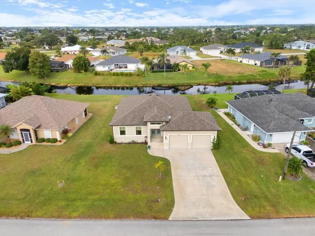 an aerial view of residential houses with outdoor space