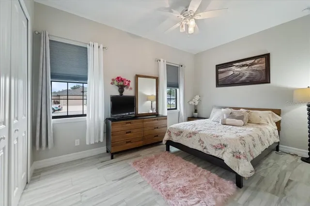 a view of a house with swimming pool and sitting space