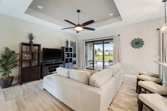 a view of a living room kitchen and a wooden floor