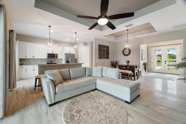 a kitchen with stainless steel appliances granite countertop a refrigerator and a stove top oven