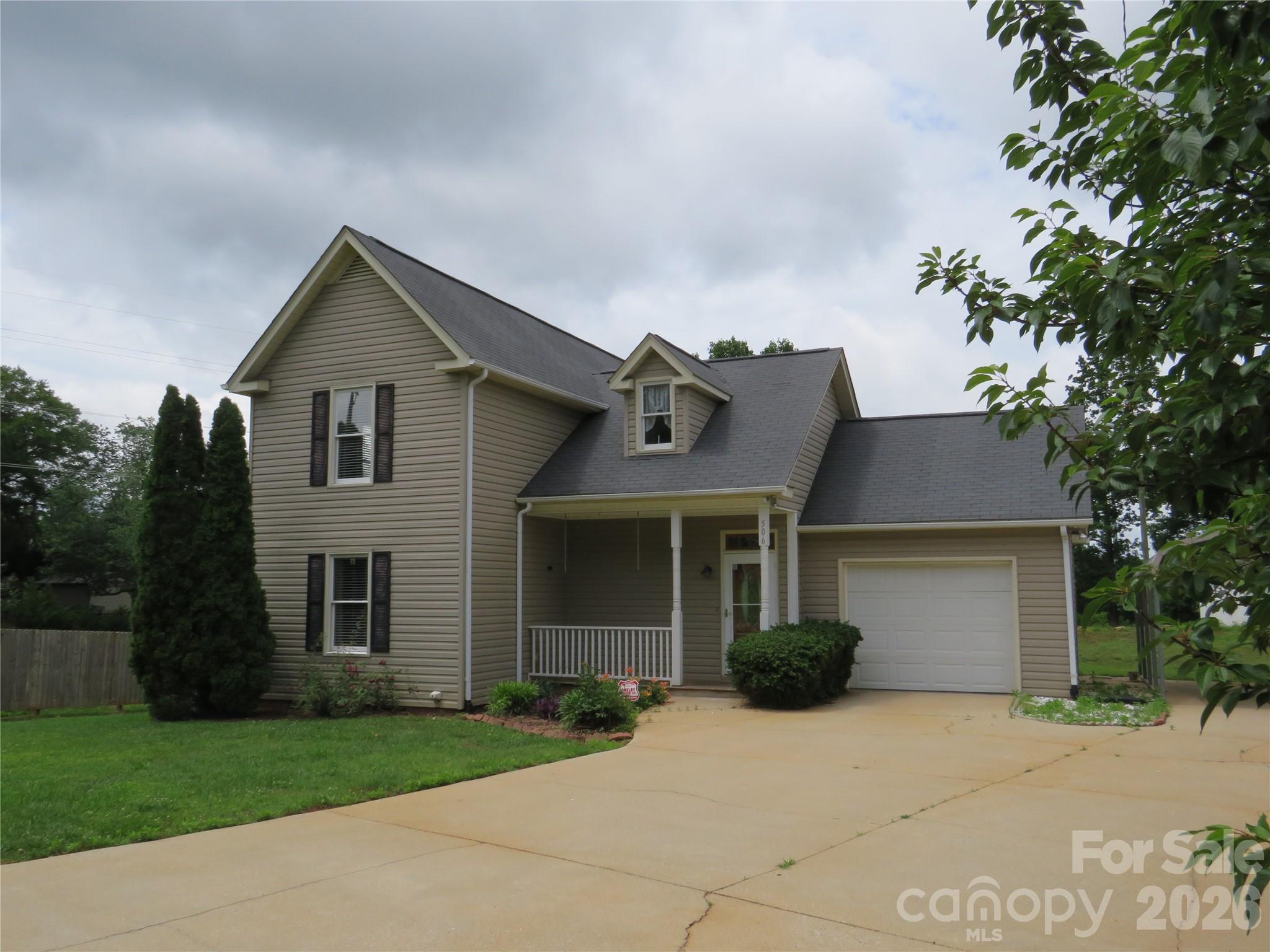 506 Pleasant Street Spindale, NC 28160 - Photo 39 of 42 a front view of a house with garden