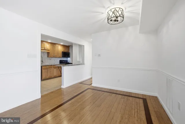 a view of kitchen with sink microwave and stove
