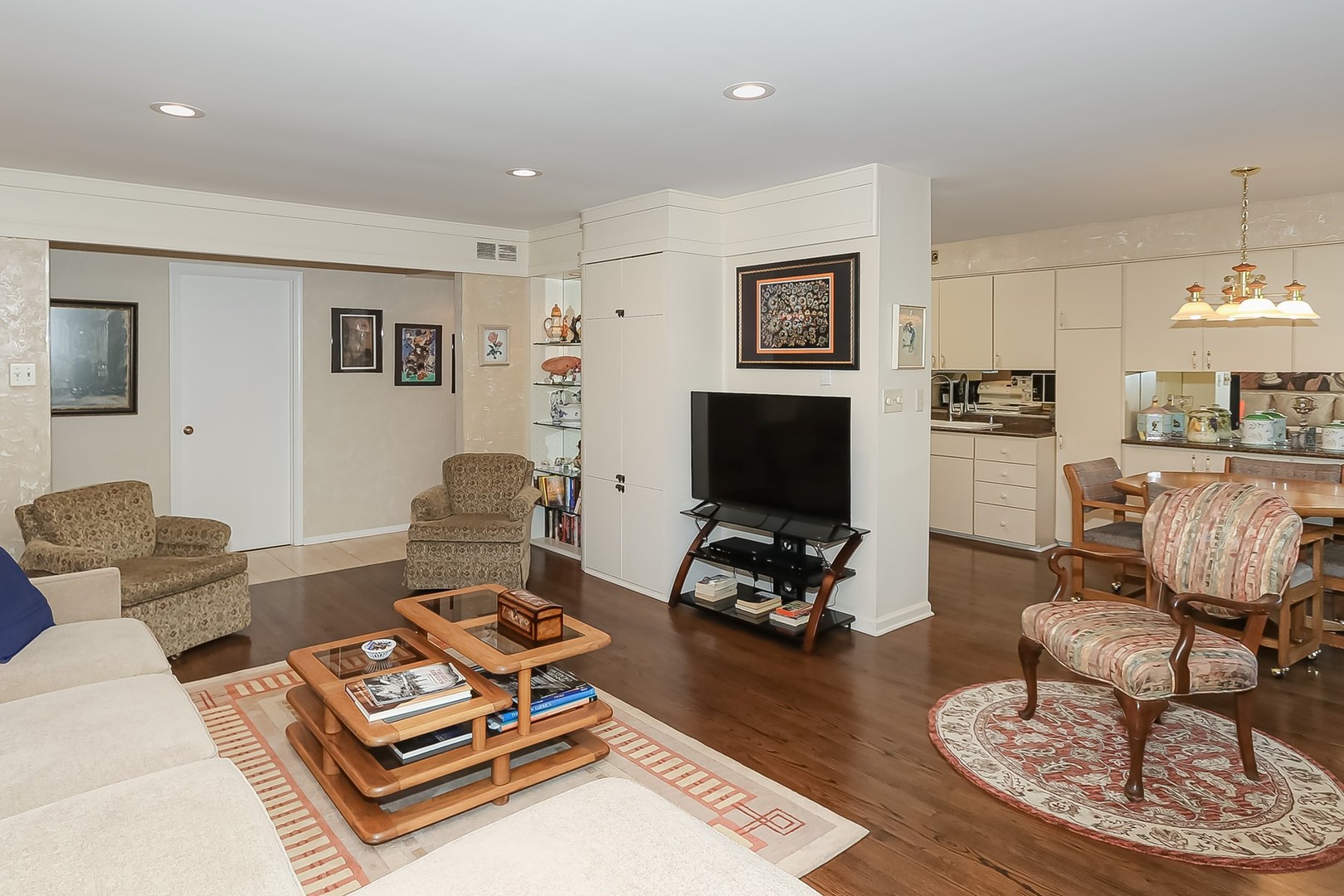 1175 Lake Cook Road, Unit 409 Northbrook, IL 60062 - Photo 12 of 27 a living room with furniture a flat screen tv and a table