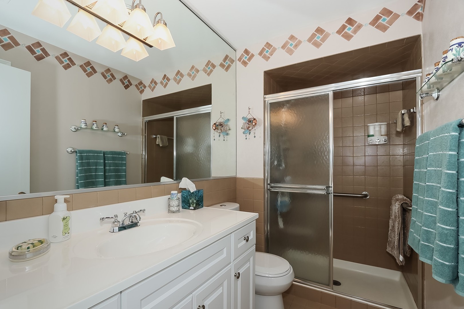 1175 Lake Cook Road, Unit 409 Northbrook, IL 60062 - Photo 20 of 27 a bathroom with a sink toilet and shower
