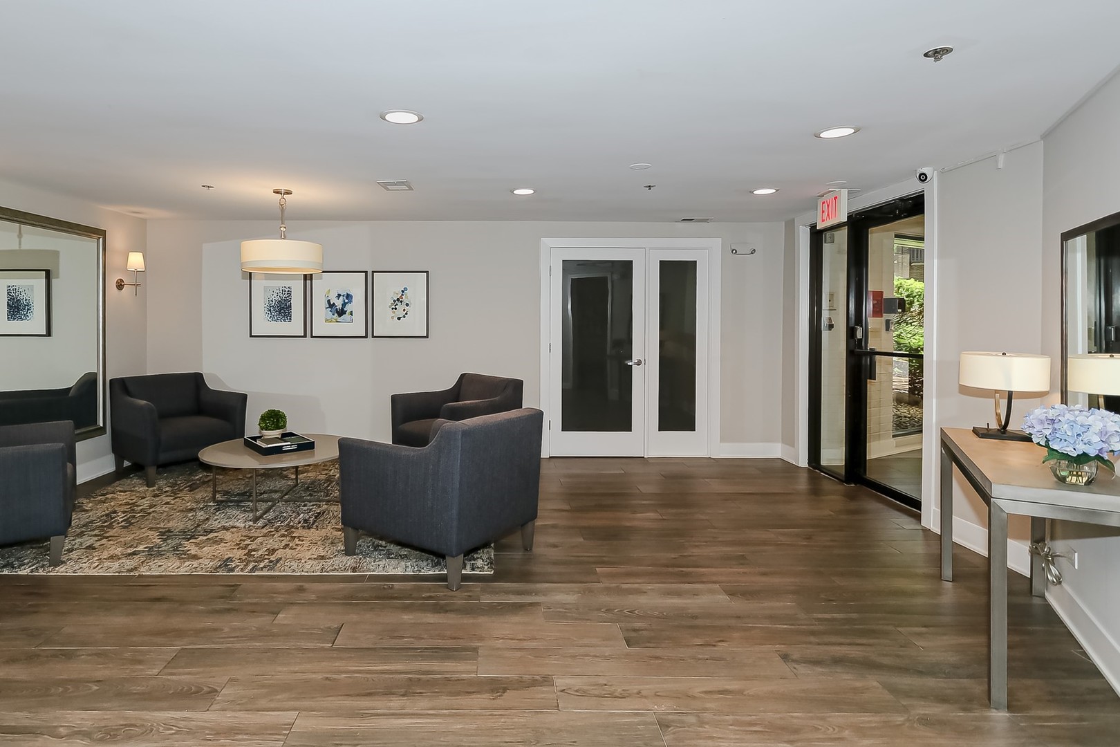 1175 Lake Cook Road, Unit 409 Northbrook, IL 60062 - Photo 25 of 27 a living room with furniture and a wooden floor
