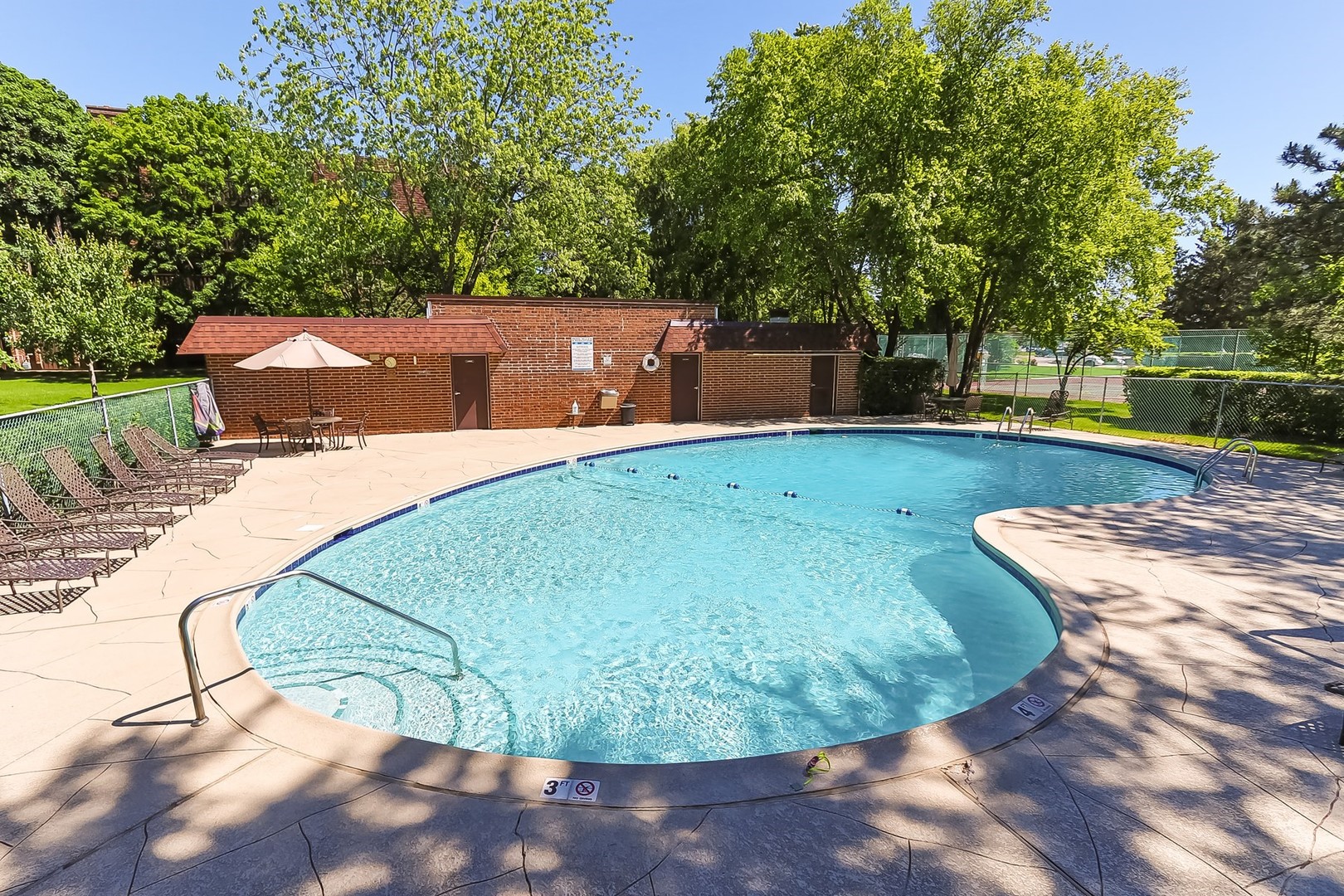 1175 Lake Cook Road, Unit 409 Northbrook, IL 60062 - Photo 26 of 27 a view of a swimming pool with a patio and plants
