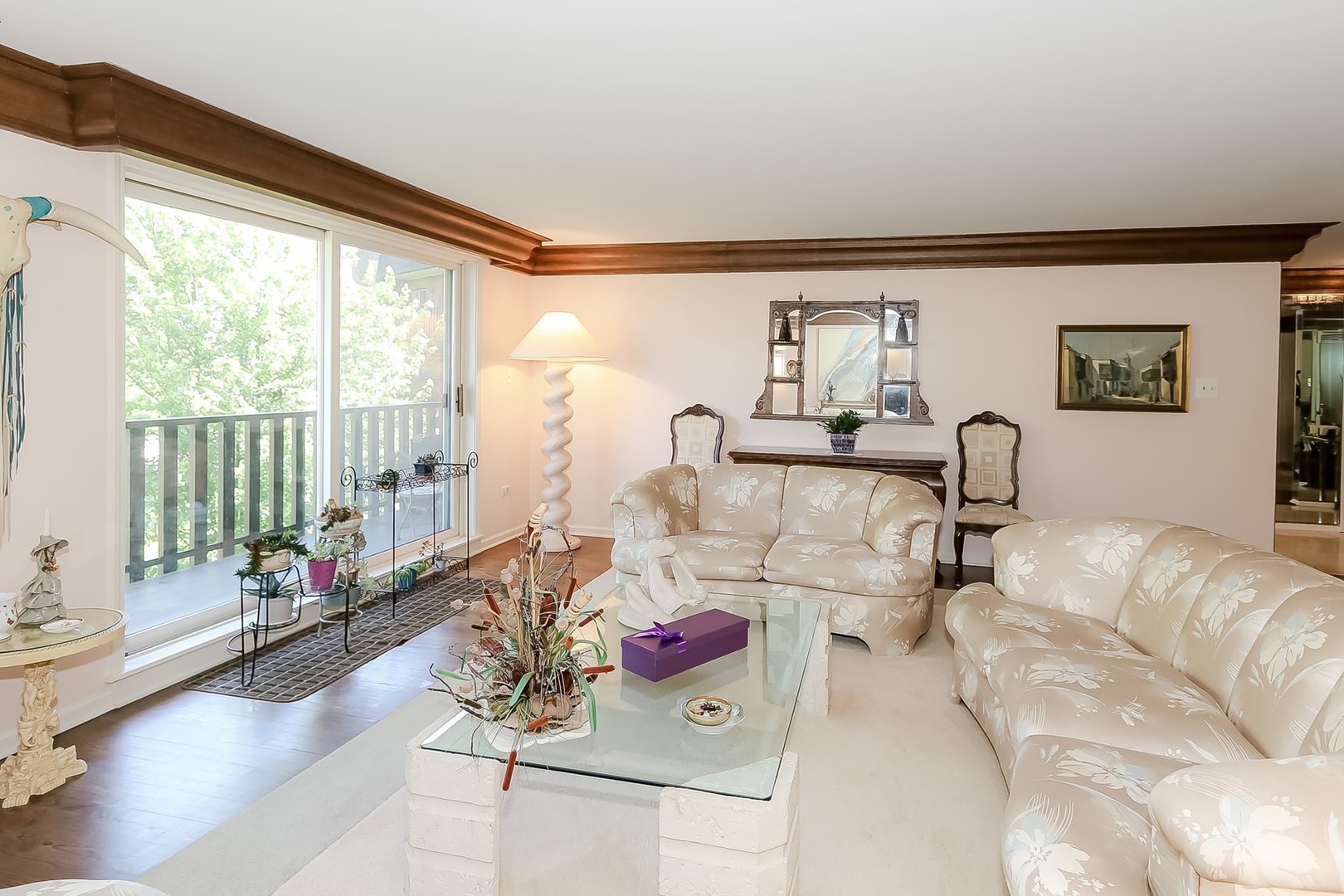 1175 Lake Cook Road, Unit 409 Northbrook, IL 60062 - Photo 3 of 27 a living room with furniture and a large window