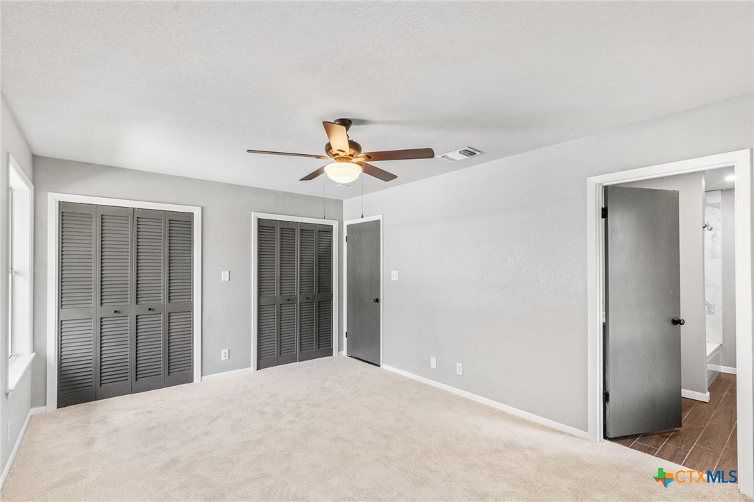 116 Newport Drive Victoria, TX 77904 - Photo 19 of 25 a view of a livingroom with a ceiling fan and entryway