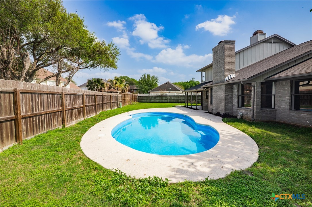 116 Newport Drive Victoria, TX 77904 - Photo 25 of 25 a view of a house with swimming pool and porch