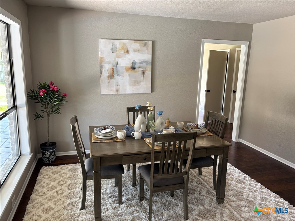 116 Newport Drive Victoria, TX 77904 - Photo 8 of 25 a view of a dining room with furniture and a potted plant
