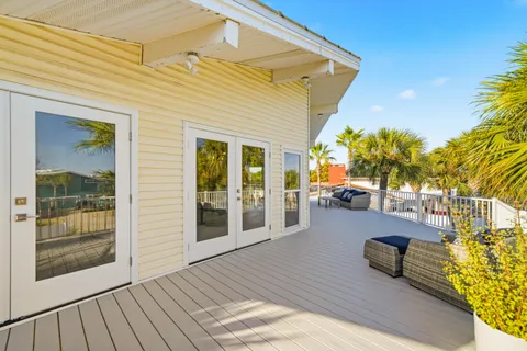 a view of a house with sitting area and view of a swimming pool