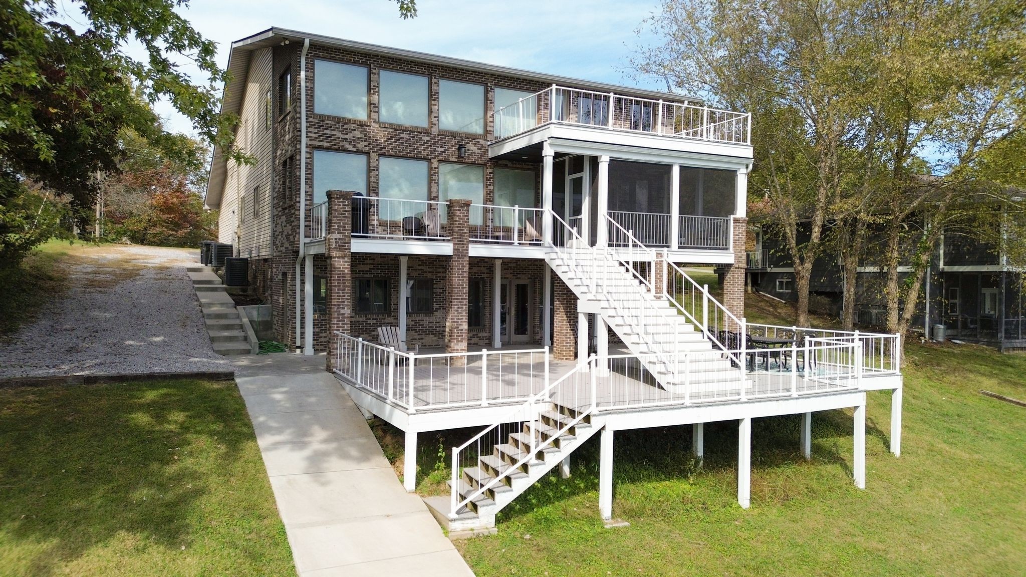 a view of house with a yard and seating space