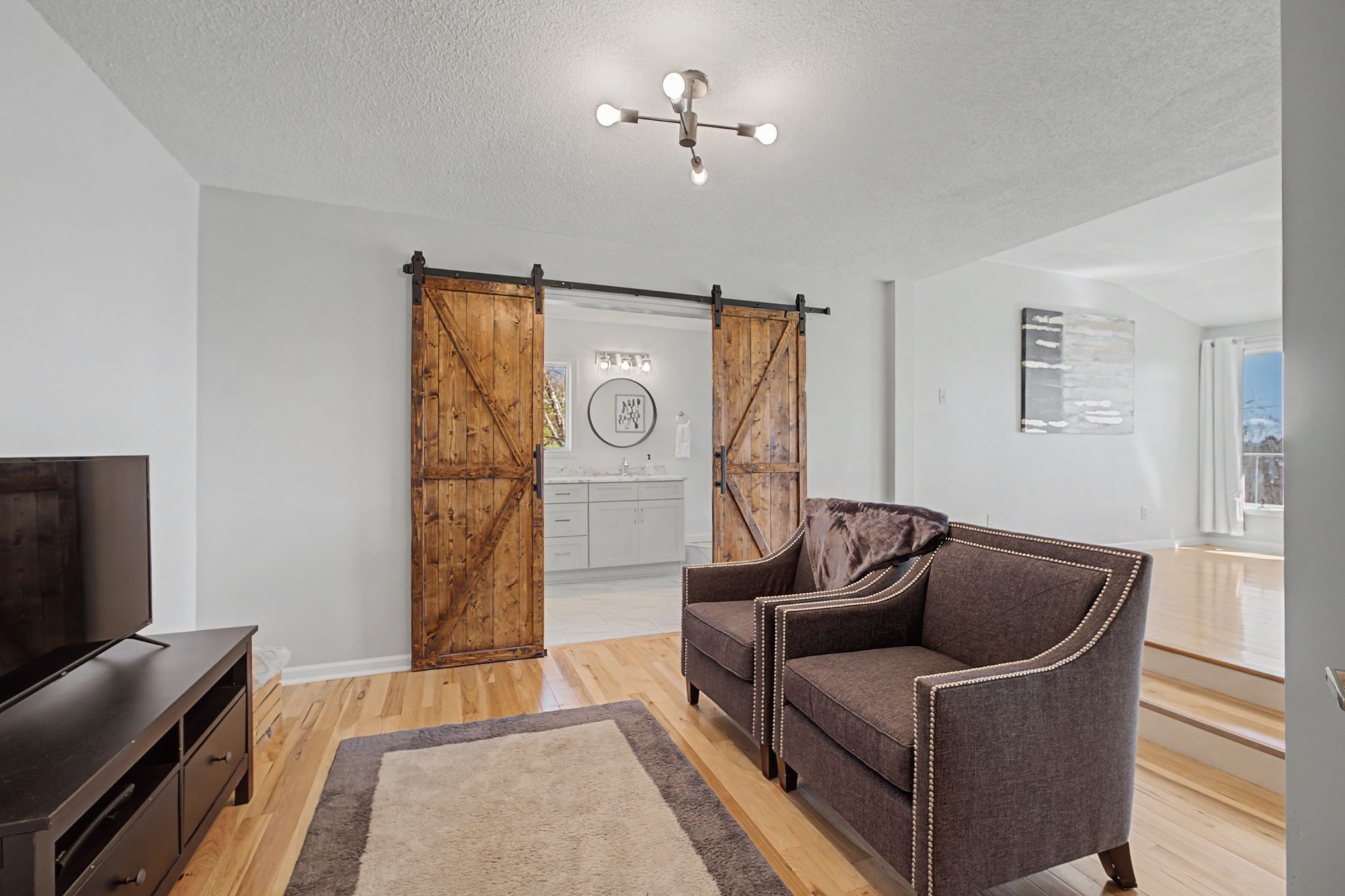 1601 Damron Road Estill Springs, TN 37330 - Photo 23 of 59 a living room with furniture and a flat screen tv