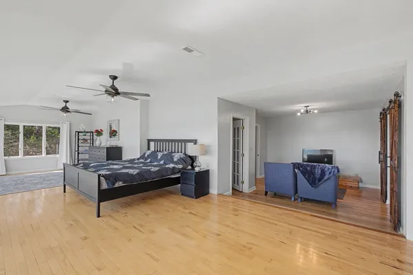 a room with furniture and wooden floor