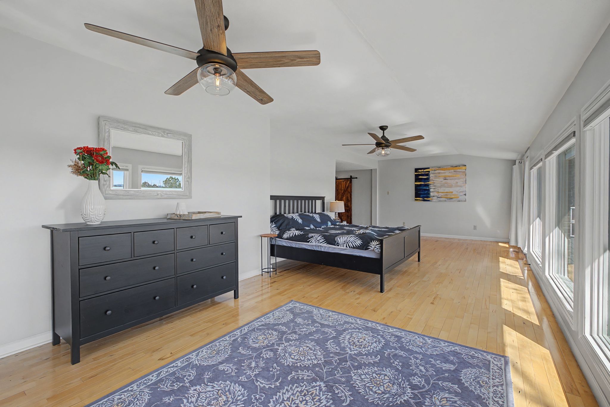 1601 Damron Road Estill Springs, TN 37330 - Photo 29 of 59 a bedroom with a bed and a chandelier