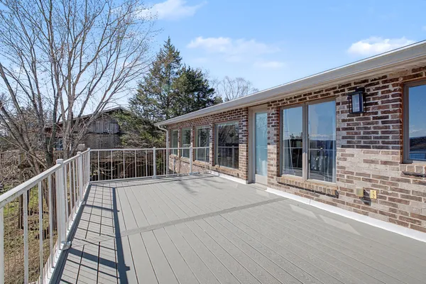 a balcony with wooden floor