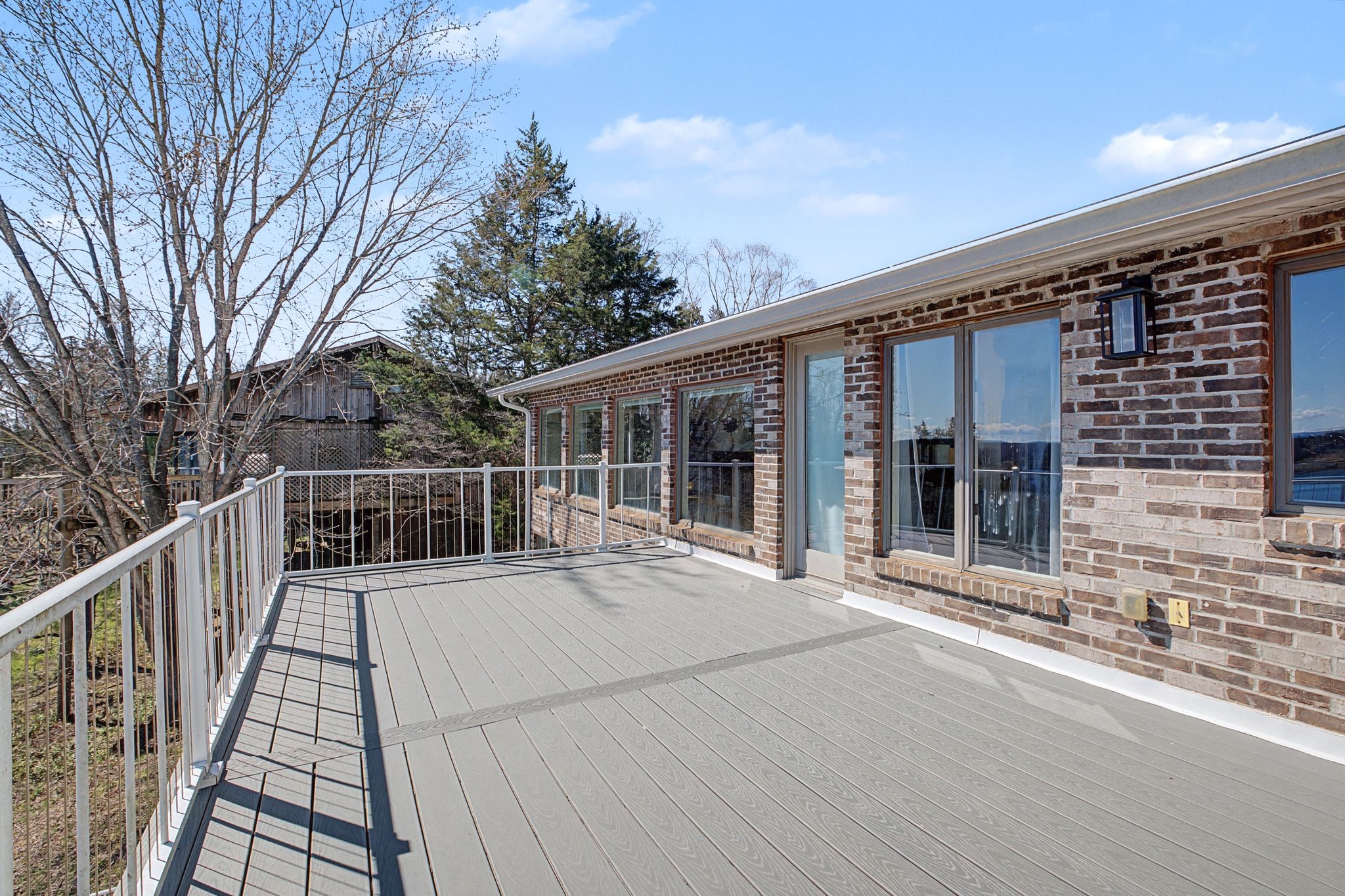 1601 Damron Road Estill Springs, TN 37330 - Photo 33 of 59 a view of a house with a large window and wooden fence