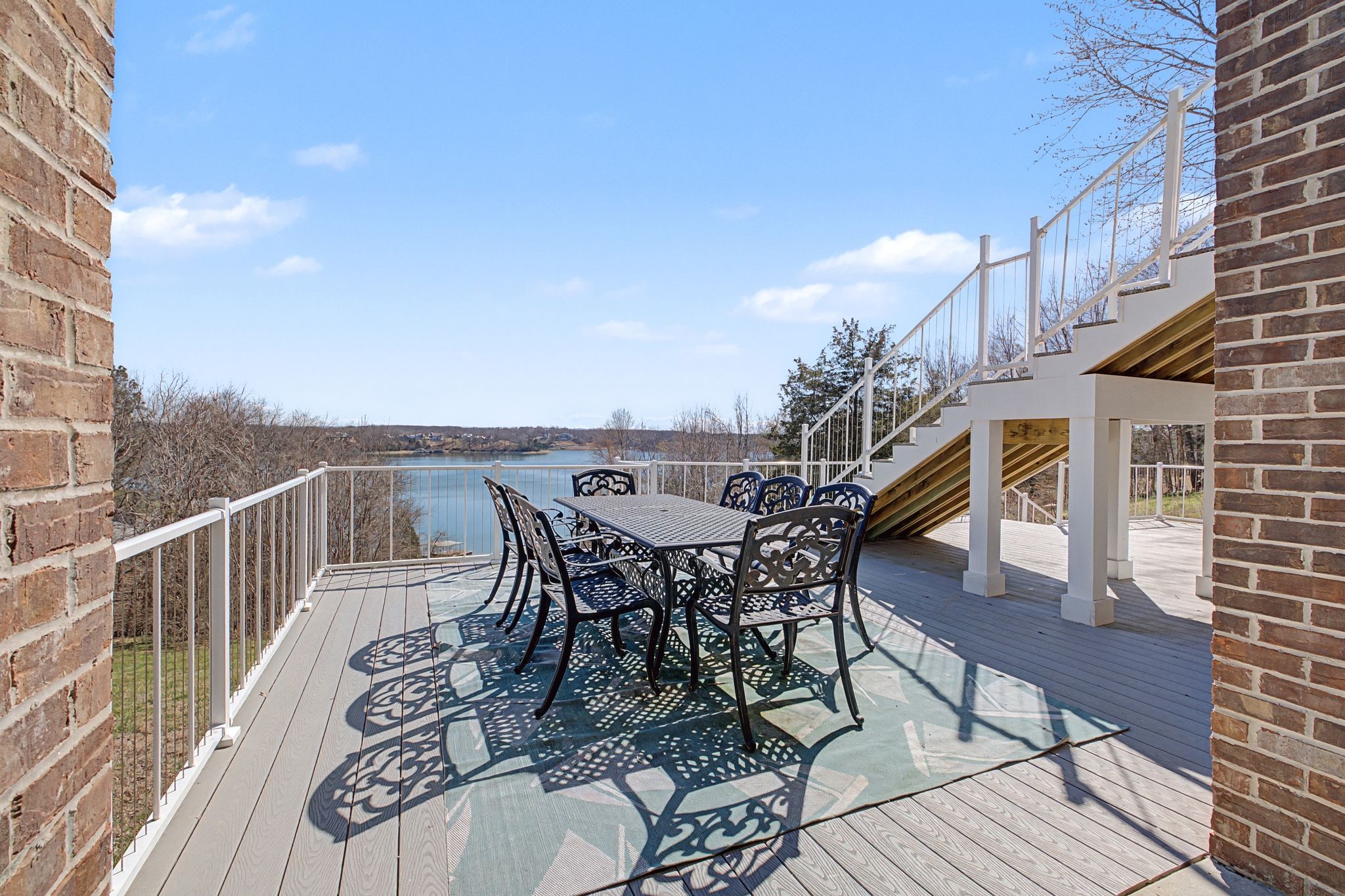 1601 Damron Road Estill Springs, TN 37330 - Photo 36 of 51 a view of a roof deck with table and chairs with wooden floor and fence
