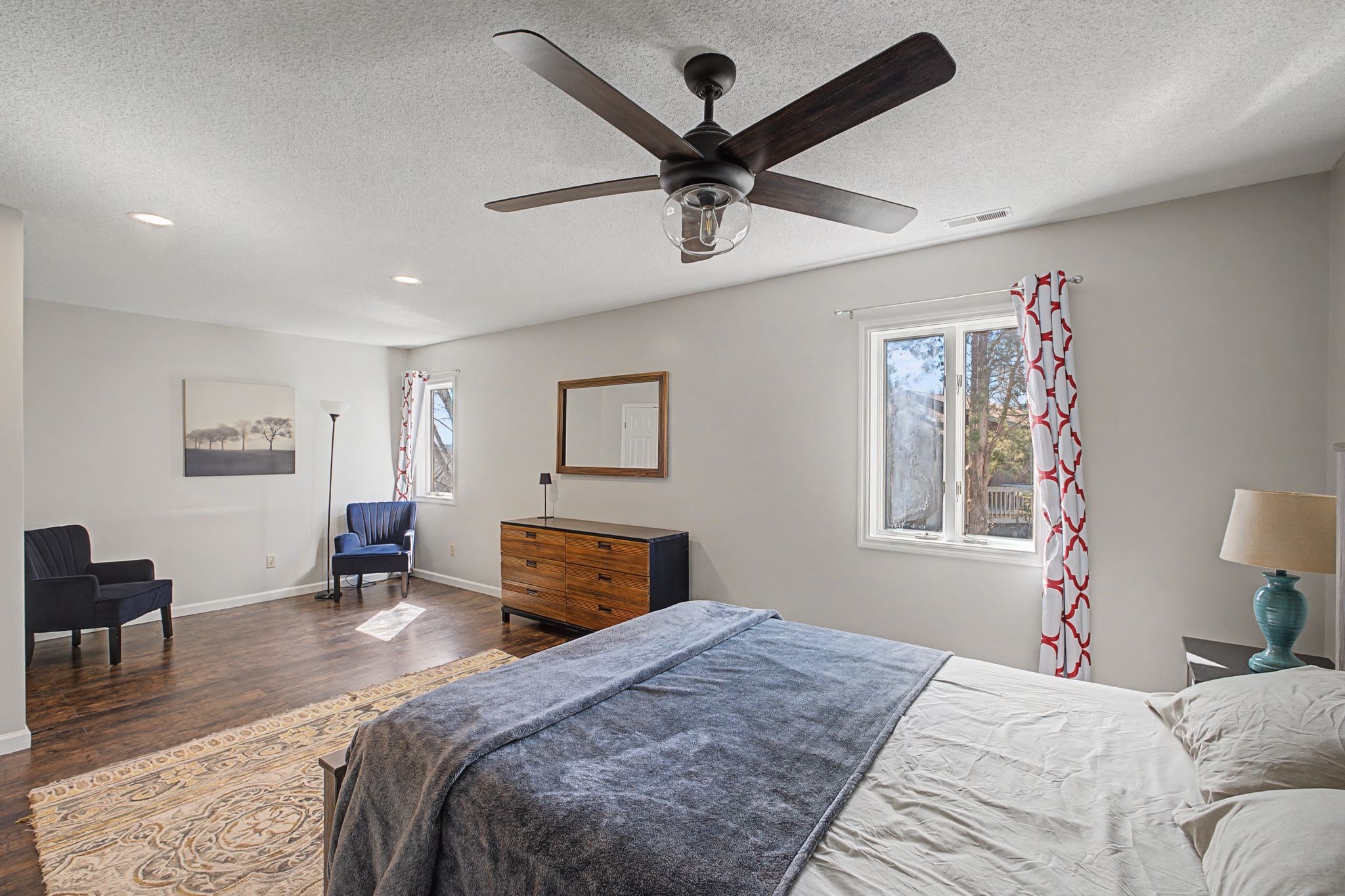 1601 Damron Road Estill Springs, TN 37330 - Photo 38 of 59 a bedroom with a large bed a chandelier and a window