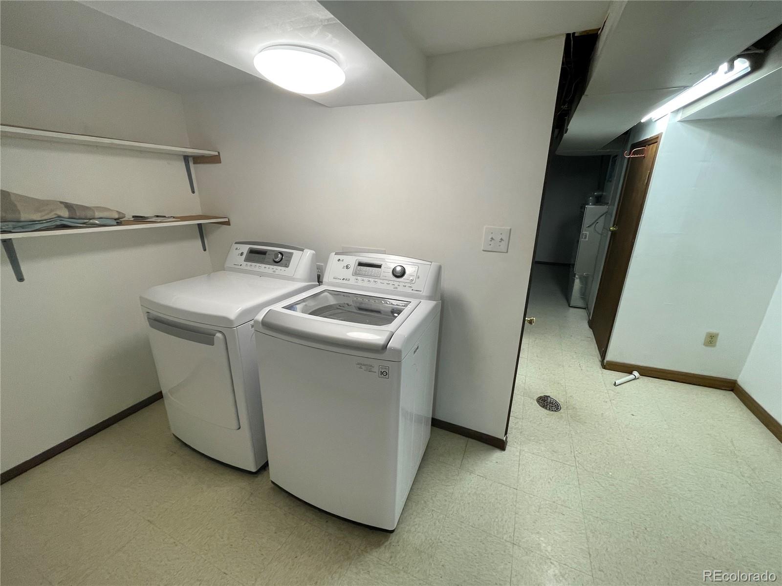 3086 Victor Street Aurora, CO 80011 - Photo 24 of 30 a utility room with dryer and washer