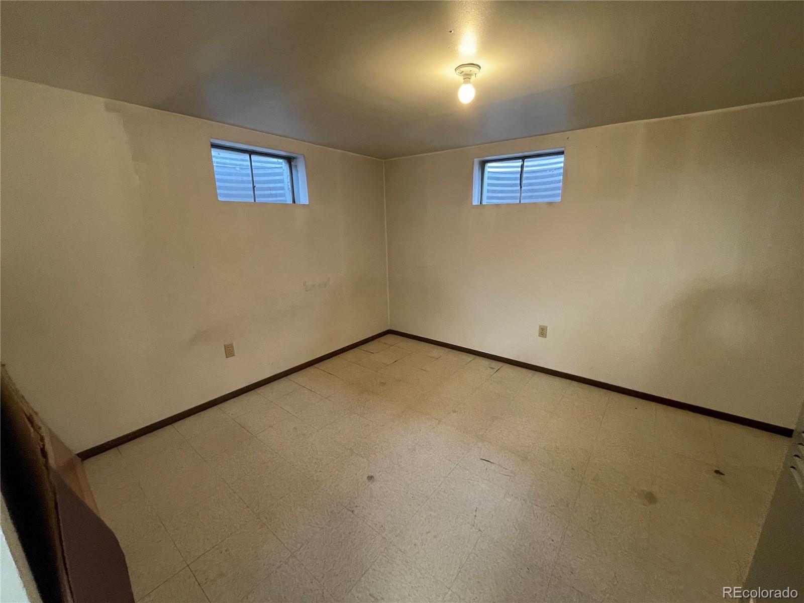3086 Victor Street Aurora, CO 80011 - Photo 25 of 30 an empty room with windows