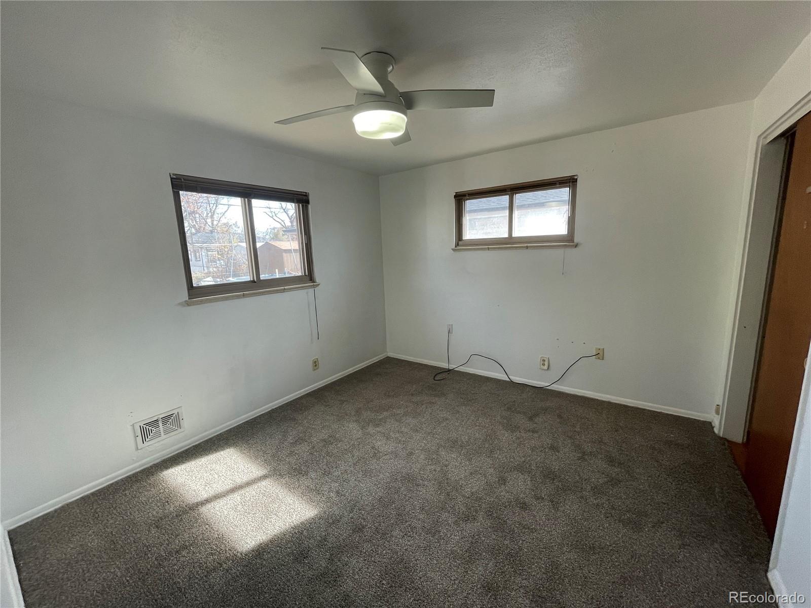 3086 Victor Street Aurora, CO 80011 - Photo 9 of 30 an empty room with a window