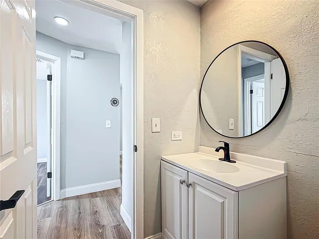a bathroom with a sink and a mirror